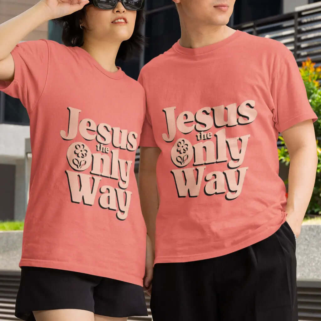Two people wearing pink Jesus The Only Way T-shirts, showcasing comfort and style in a casual setting.